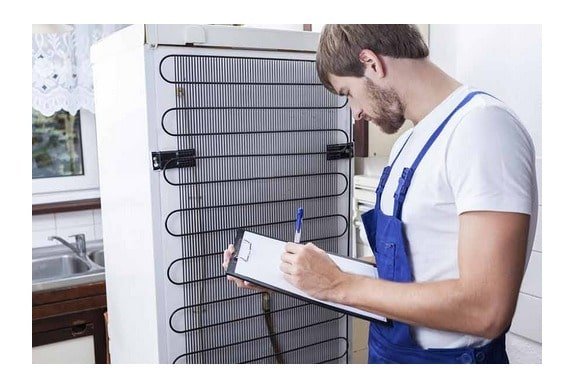 A professional technician assessing the cooling setup mechanics inside an LG refrigerator assembly panel