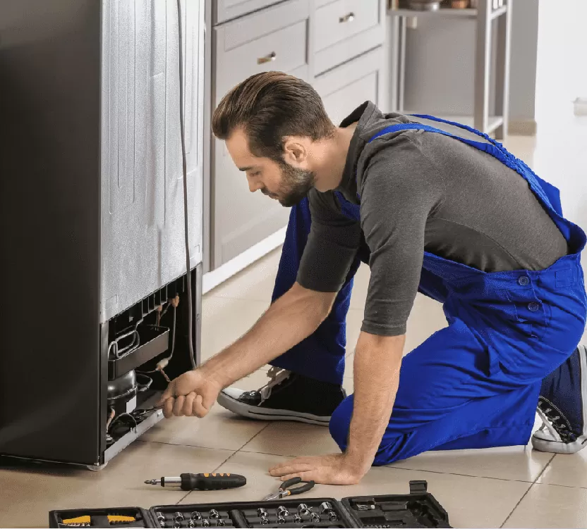 Refrigeration unit exhibiting common water leakage floor pooling issues requiring repair